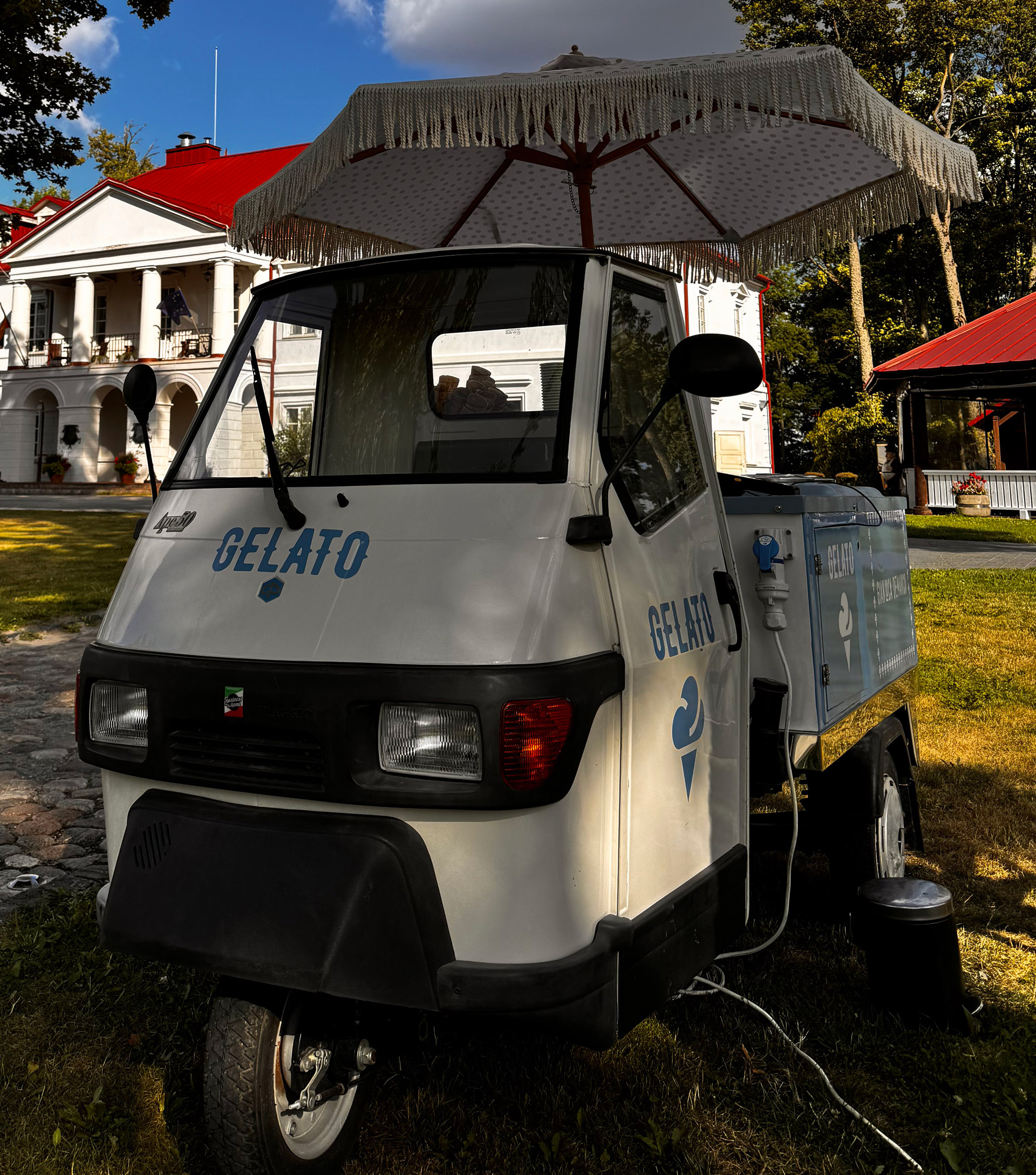 Piaggio Ape 50 front view — classic Italian three-wheeler with GELATO lettering