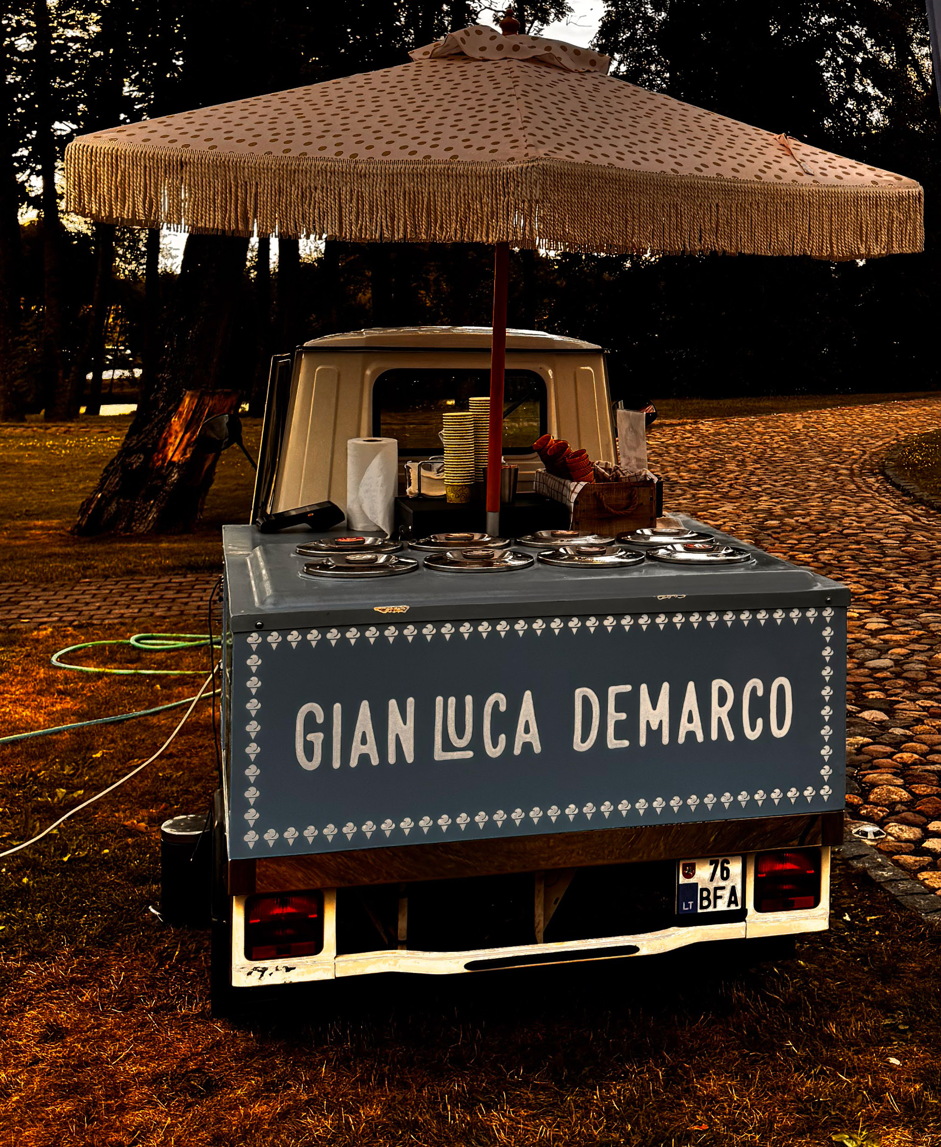 Piaggio Ape 50 gelato truck with 24 stainless steel ice cream pans on display
